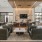 a large lounge room with seating and a large glass windows