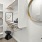 a room with a mirror and shelves