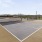 a tennis court with a fence