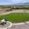 a large green lawn with a playground
