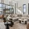 a lounge room with seating and a large glass wall