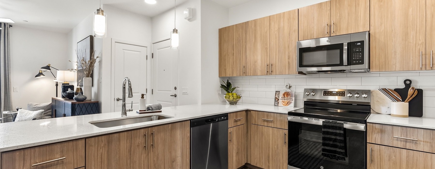 a kitchen with wood cabinets