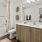 a bathroom with a tub sink and toilet