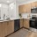 a kitchen with wooden cabinets